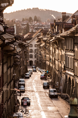 BERN, SWITZERLAND - APR 13: Street view of houses and car parking in Bern, Switzerlandのeditorial素材