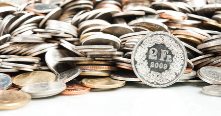 Swiss Franc Coin with Pile of Coinの写真素材