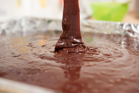 pour chocolate into trayの写真素材