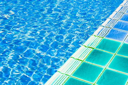 Texture of swimming pool floor trough waterの写真素材