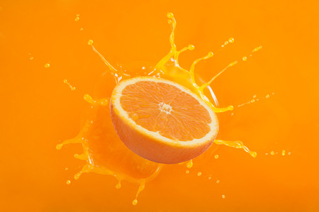 splash orange juiceの写真素材