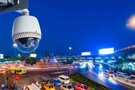 CCTV Camera or surveillance Operating with city traffic の写真素材