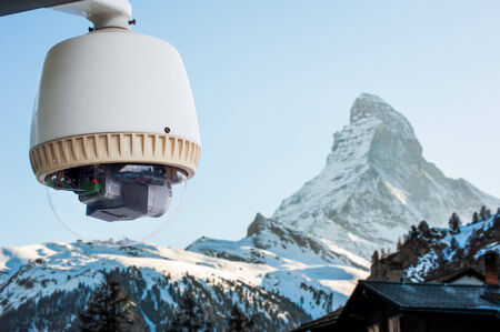 CCTV Camera or surveillance operating with Matterhorn snow mountain の写真素材