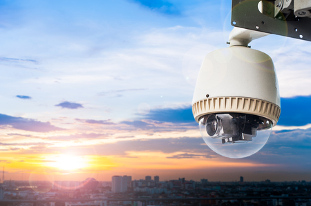 CCTV camera or surveillance with sunset sky backgroundの写真素材