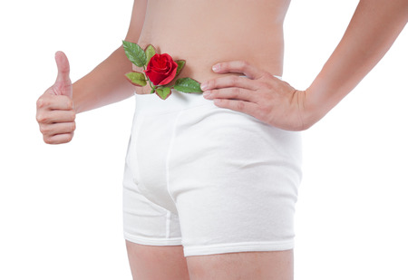 close up of man on white boxer underware  with rose pop out isolate on white backgroundの写真素材