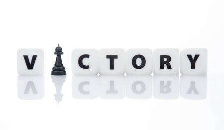 Letters block business concept for win or victory with chess characterの写真素材