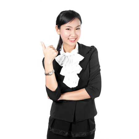 Young business woman showing like sign by thumb's upの写真素材