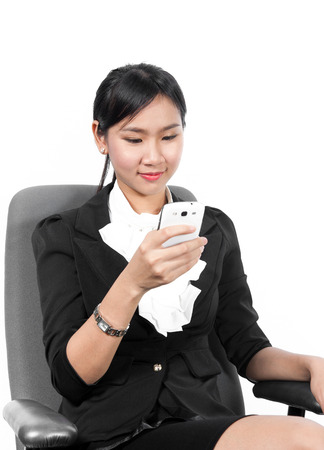 Young pretty business woman using mobile phoneの写真素材