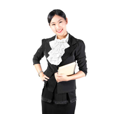 Young pretty business woman holding bookの写真素材