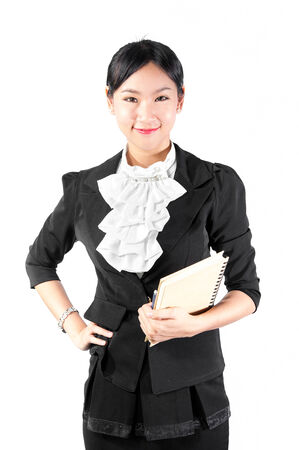 Young pretty business woman holding bookの写真素材