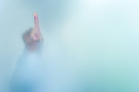 hand writing on blurred glass wall, abstract background with space editableの写真素材