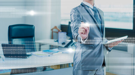 Businessman pressing on digital virtual screenの写真素材