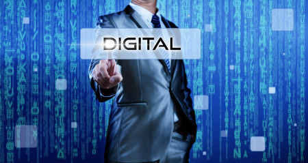 Business man with digital background pressing on button digitalの写真素材
