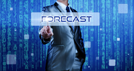 Business man with digital background pressing on button forecastの写真素材