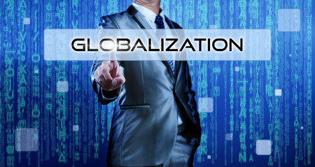 Business man with digital background pressing on button globalizationの写真素材