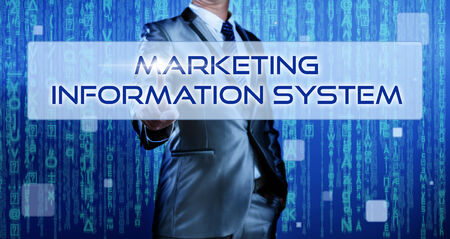 Business man with digital background pressing on button marketing information systemの写真素材