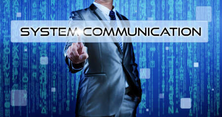 Business man with digital background pressing on button system communicationの写真素材