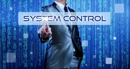 Business man with digital background pressing on button system controlの写真素材