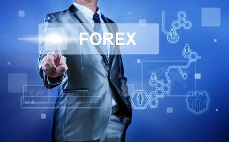 Business man with digital screen press on button forex for word foreign exchangeの写真素材