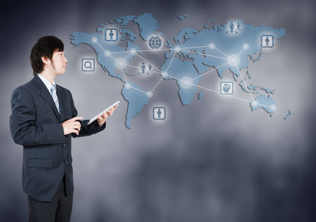 Asian businessman using tablet, business concept of globalizationの写真素材