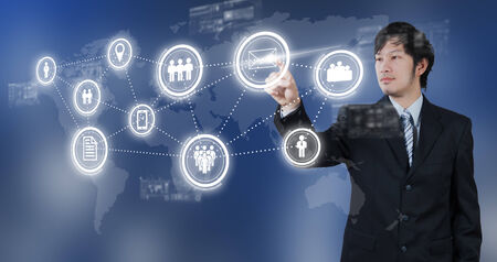 Businessman pressing on email digital icon, business conceptの写真素材