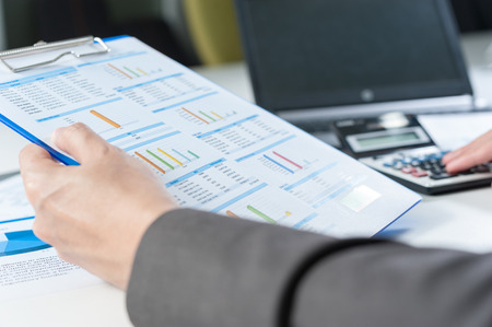 Businessman using calculator analyze reportの写真素材