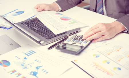 Businessman show analyzing report, business performance conceptの写真素材