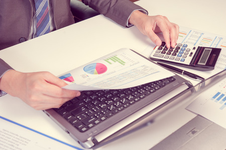 Businessman show analyzing report, business performance conceptの写真素材