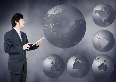 Asian Businessman choosing Asia continent, business concept of decision makingの写真素材