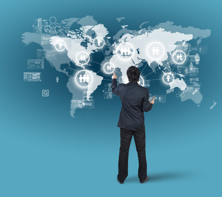 Businessman pressing on digital virtual screen, globalization marketing conceptの写真素材