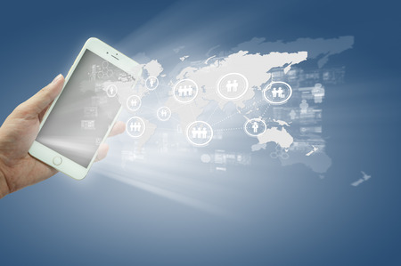 Globalization or Social network concept background with new generation of mobile phoneの写真素材