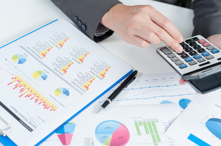 Businessman using calculator analyze reportの写真素材
