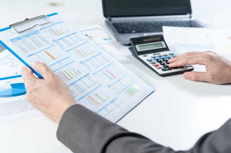 Businessman using calculator analyze reportの写真素材