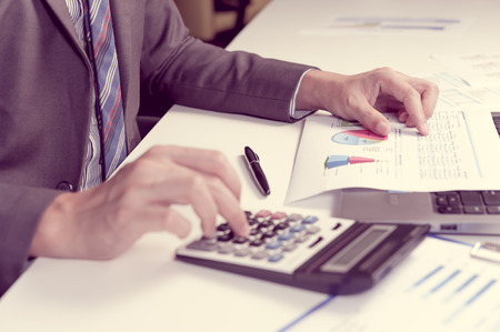 Businessman show analyzing report, business performance conceptの写真素材