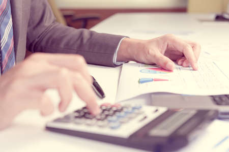 Businessman analyzing report, business performance conceptの写真素材