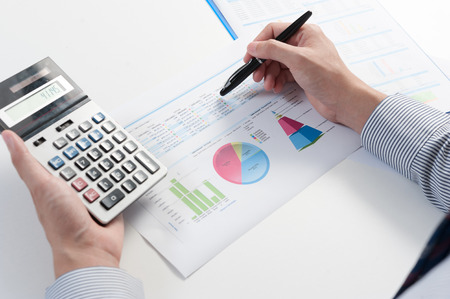 Businessman analyzing report, business performance conceptの写真素材