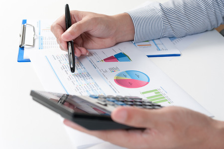 Businessman analyzing report, business performance conceptの写真素材