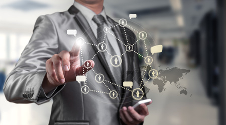 Businessman pressing on digital virtual screen, human resource management conceptの写真素材