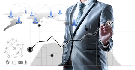 Business man in blue grey suit using digital pen working with digital virtual screen business concept of human resourceの写真素材
