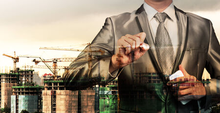 double layer of businessman and construction site, business conceptの写真素材