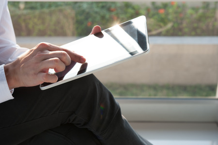 Hand of man use tablet
