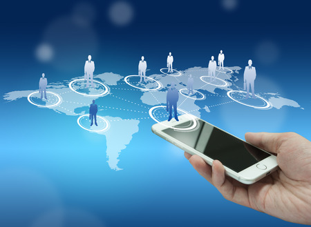 Globalization or Social network concept background with new generation of mobile phoneの写真素材