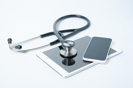 Stethoscope with tablet and smart phone on white backgroundの写真素材