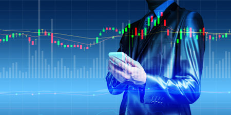 double exposure of businessman with stock market chartの写真素材