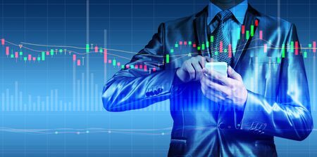 double exposure of businessman with stock market chartの写真素材