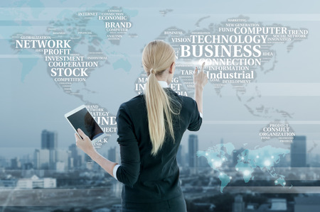 Businesswoman working on digital virtual screen, business strategy conceptの写真素材