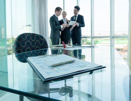 business partners discussing documents and ideas at meeting