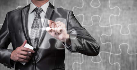 businessman draw jigsaw line, business strategy conceptの写真素材