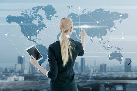Businesswoman working on digital virtual screen, business strategy conceptの写真素材