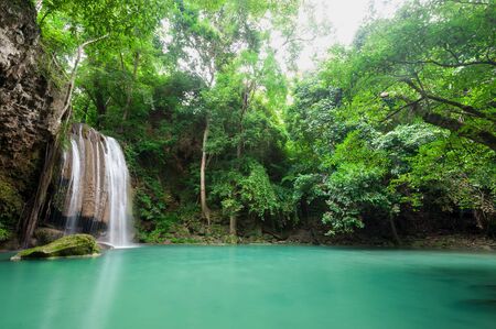 Deep forest waterfall at Erawan waterfall National Park Kanchanaburi Thailandの写真素材